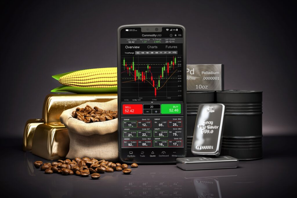 Celular com plataforma de negociação na frente de commodities representando investimento em Fiagro